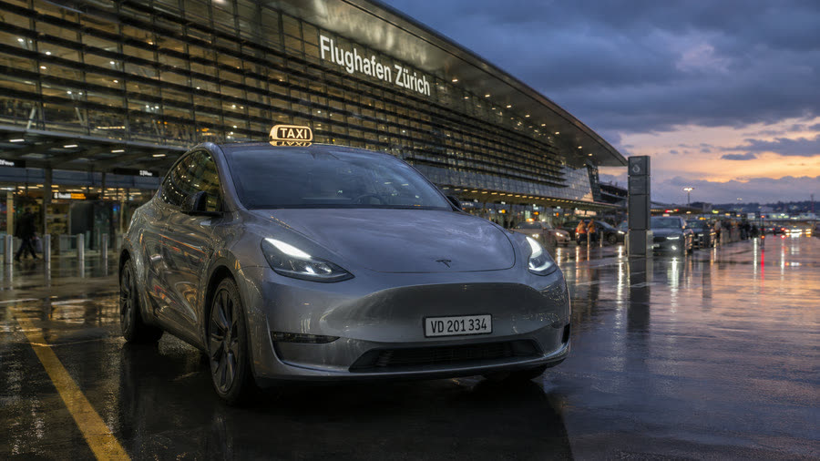 TAXI 624 Tesla Model Y taxi at the Zurich Airport terminal — Lausanne–Zurich Airport transfer at a fixed price