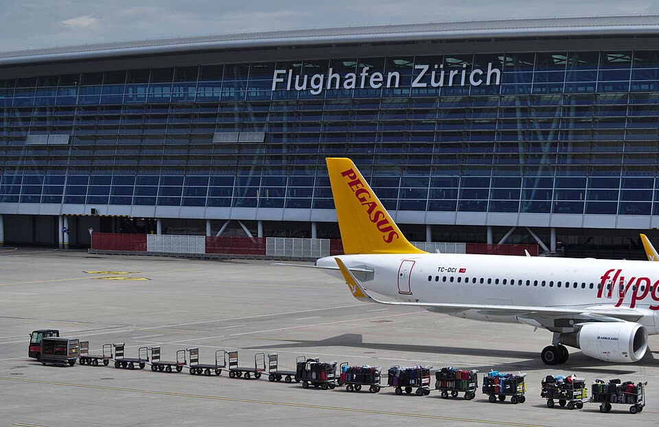 Zurich Airport (ZRH) terminal — taxi transfer from Lausanne